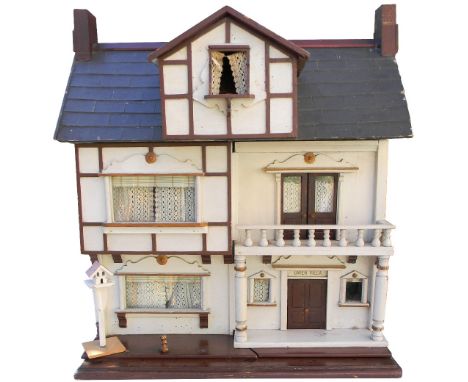 ‘Gwen Villa’ Lines Bros Ltd painted wooden dolls house similar to ‘The clock House’ model: 34, with contents, English 1909-10