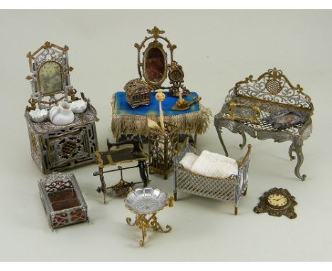 Soft metal dolls house furniture, German 1880s-90s, including pieced metal silver and gilt washstand with mirror 4 ½” (11cm) 