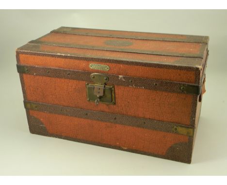 A rare Au Nain Bleu presentation dolls trunk, French circa 1900, the light tan and brown faux-leather trunk with dark brown s