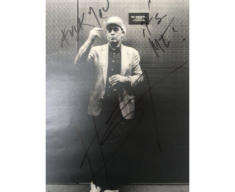 A signed image of Hunter S Thompson. The black and white image bears the initials H S T below a comical caption hand written 