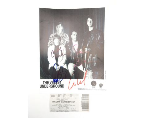 A photocopy of a press photo of the Velvet Underground signed by the four photographed members of the bands. Signatures compr