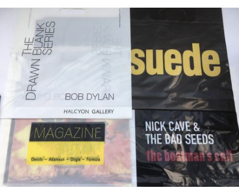 A collection of promotional carrier bags for various bands including Bob Dylan, Nick Cave, Magazine, Suede and others.