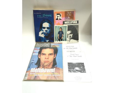A Nick Cave signed copy of Time Out magazine, autograph to the front cover, a signed postcard of Nick Cave in Polaroid style 
