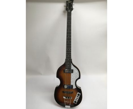 A Hofner Ignition Beatles bass guitar in classic McCartney violin shape with a sunburst finish. The body has a spruce top and