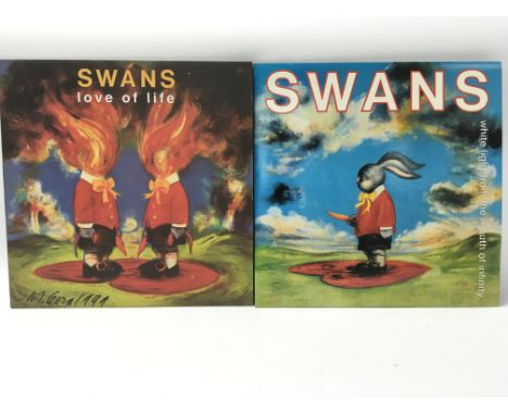 A signed copy of Love Of Life by a Swans, besting the autograph of Michael Gira, alongside a copy of White Light From The Mou