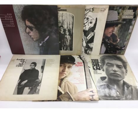 Seven Bob Dylan LPs comprising his first three LPs, 'Blood On The Tracks', 'Desire' and others. Please note the first three L