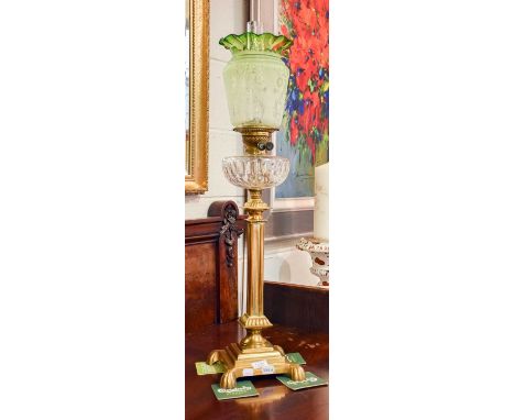 An Oil Lamp, Victorian, with etched green glass shade, clear reservoir and brass fluted square pedestal over stepped square p