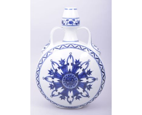 A CHINESE MING STYLE BLUE AND WHITE TWIN HANDLE MOON FLASK, the centre decorated with yin yang design, with four character ma