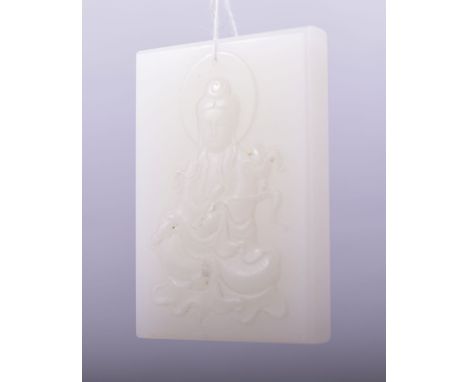 A CHINESE CARVED JADE RECTANGULAR AMULET, carved with a buddha, 7.5cm x 5cm.