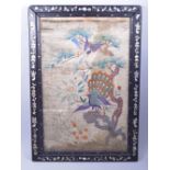 A CHINESE FRAMED EMBROIDERED PICTURE PANEL, embroidered with a peacock and flora, the hardwood frame