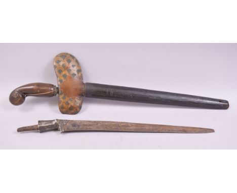 A SOUTH EAST ASIAN KRIS DAGGER, 43cm long, together with a similar blade, 36cm long (2).