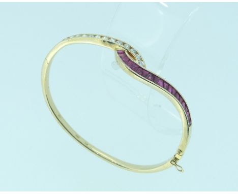 A diamond and ruby hinged Bangle, the front of two S-shapes, one set with thirteen circular cut diamonds, the other with twen