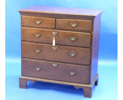A Georgian oak Chest of Drawers, with two short above three long graduating drawers, raised upon bracket feet, 38in (97cm) wi