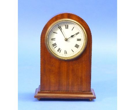 An Edwardian mahogany inlaid Mantel Clock, with arched top and enamel dial, raised on brass bun feet, 8¼in (21cm) high.