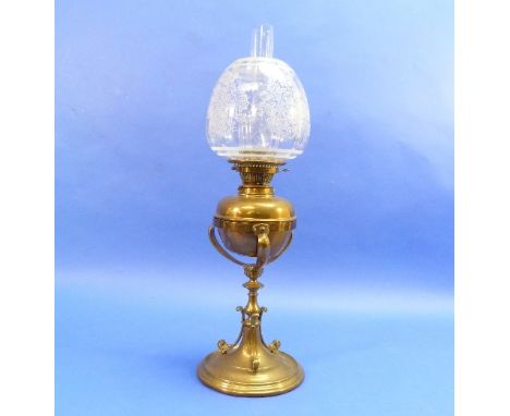 An Edwardian brass Oil Lamp, on bulbous central column and circular base, with scrolling supports and etched shade, 26in (66c