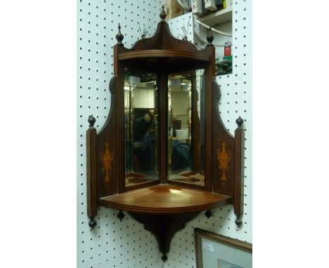 An Edwardian rosewood mirrored wall-hanging corner Shelf, with boxwood stringing and marquetry decoration, 34in (86cm) high.