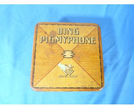 A Bing Pigmy phone toy gramophone, circa 1920's, clockwork tin plate with hinged cover and trumpet speaker.