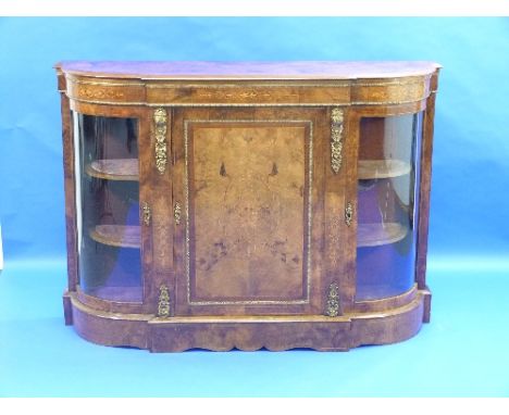 A Victorian walnut inlaid Credenza, with gilt metal mounts and boxwood stringing, the shaped top above central panel door fla