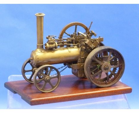 A vintage brass model of a Steam Engine, 16in (40.5cm) long, with wood base.