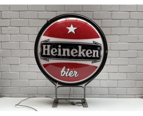 Large double-sided Heineken Bier light up sign in working condition.    Height: 100 cm. Width: 85 cm. Depth: 27 cm. Condition