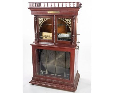 Coin-operated Regina 27" style 34 automatic disc-changing music box with gallery, ca 1905. Overall very good condition, singl