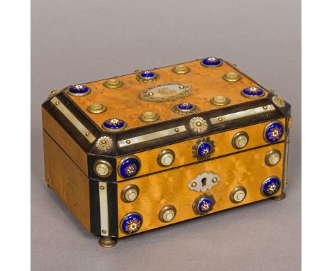 A 19th century French mother-of-pearl and enamel decorated jewellery box Of caned hinged rectangular form, set with mother-of