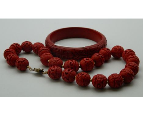 A Chinese necklace and a Chinese bangle. The former 36 cm long.