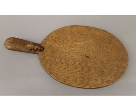 A Mouseman cheeseboard. 39.5 cm long.