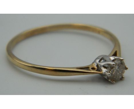 A 9 ct gold 0.25 carat diamond solitaire ring. Ring Size P. 1 gram total weight.