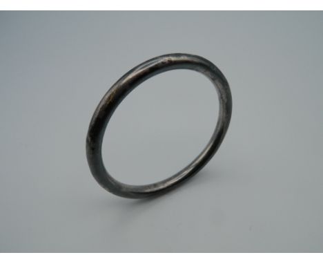 A Charles Horner silver bangle. 19.4 grammes.