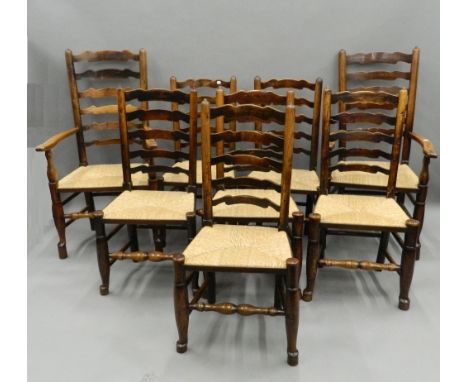 A harlequin set of eight 19th century elm and ash ladder back dining chairs. The carvers 116 cm high.
