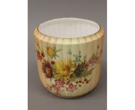 A Royal Worcester blush ivory ribbed flowerpot. 14 cm high.