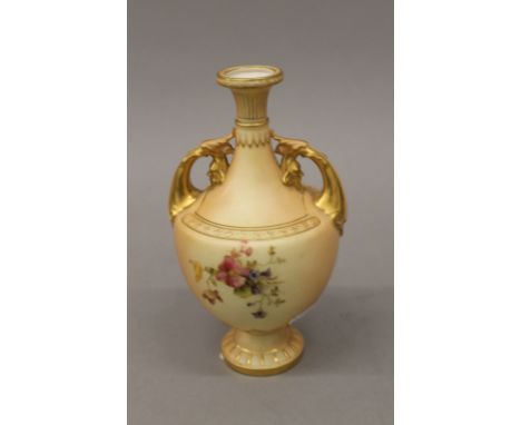 A Royal Worcester blush ivory twin handled vase. 18 cm high.