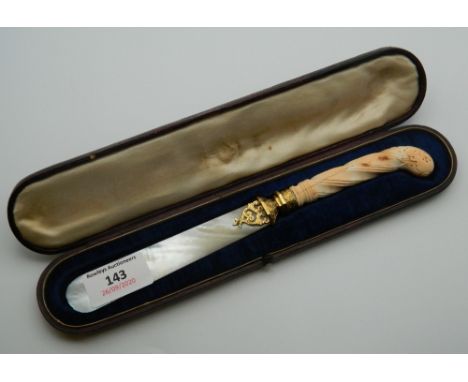 A Victorian cased carved coral handled silver gilt mounted and mother-of-pearl letter opener. 23.5 cm long.