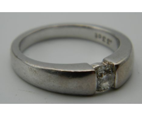 An 18 ct white gold diamond solitaire ring. Ring Size K/L. 6.1 grammes total weight.