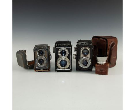 Mid-20th century manufacturers.Each with two objective lenses, one for "picture taking," the other for the viewfinder. Manufa