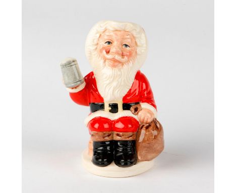 Santa seated with a bag of toys and mug in hand.Royal Doulton backstamp.  Artist: William K. Harper Issued: 1993 Dimensions: 