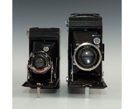 Classic roll film camera pair from Kodak, in decorative pair.Pair of vintage Kodak folding cameras. One is six-20 Kodak foldi