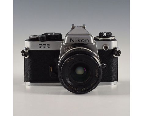 Built-in meter and self timer, advance winds and shutter fires. Issued: 1983-1987 Dimensions: 6"L X 4"D X 4"H Edition Number: