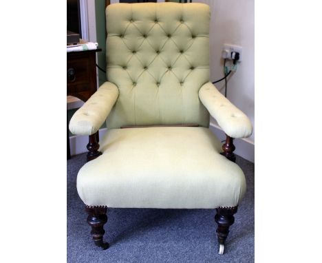 A VICTORIAN BUTTON UPHOLSTERED ARMCHAIR with turned front legs, 68cm wide