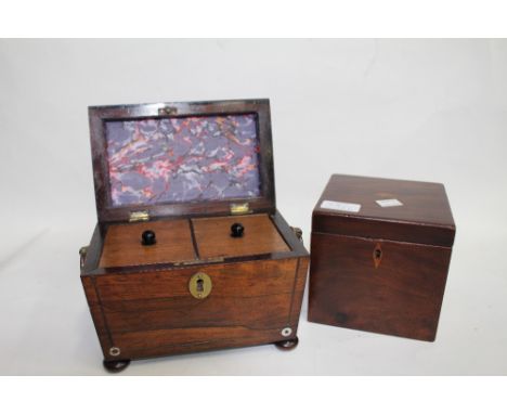 A 19TH CENTURY ROSEWOOD TEA CADDY  of sarcophagus form with mother of pearl inlay and brass ring handles and bun feet 20cm wi