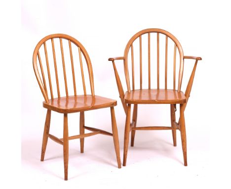 A GROUP OF EIGHT BEECHWOOD ERCOL STYLE STICK BACK KITCHEN CHAIRS (two carvers and six standards)