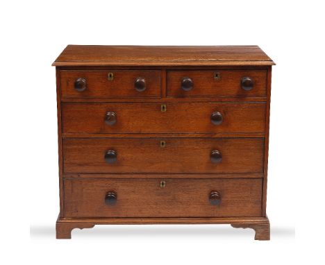 A 19TH CENTURY OAK CHEST OF TWO SHORT AND THREE LONG DRAWERS  with turned knob handles and bracket feet, 104cm wide x 50cm de