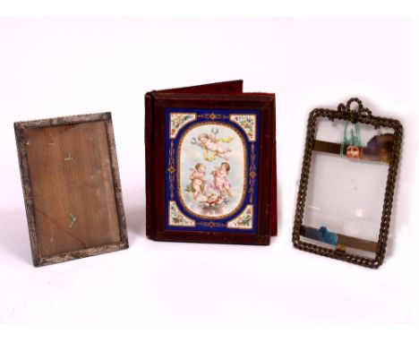 A 19TH CENTURY CORRESPONDENCE FOLDER  with enamelled panel depicting putti playing musical instruments, 23cm wide x 29cm high