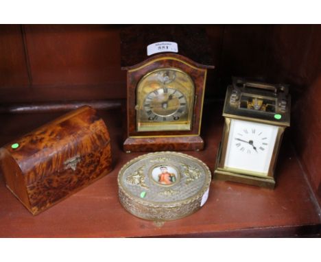 A BURR WOOD CASED MANTLE CLOCK the silvered dial with roman numerals, overall 16cm in height; a brass oval box with an inset 