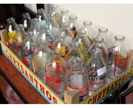 A COLLECTION OF VINTAGE MILK BOTTLES to include advertising editions including Dairy Crest Colchester Co-Op, quarter pints et