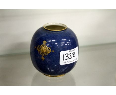A ROYAL WORCESTER OVOID VASE with cartouche of hand painted fruit, indistinctly signed with gilt decoration on a blue mottled