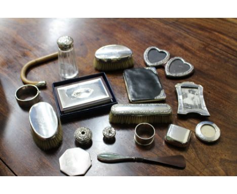 SILVER ITEMS TO INCLUDE brushes, picture frames and a compact