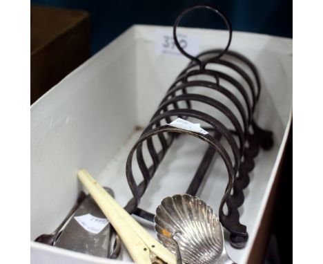 A SILVER CADDY SPOON, a silver plated toast rack, silver sugar tongs and further items