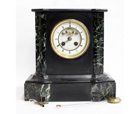 A FRENCH BLACK SLATE AND MARBLE INLAID MANTLE CLOCK retailed by Henry Marc of Paris with serial No. 42845 to the reverse, the